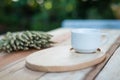 Wood dish and coffe cup on wooden table.with Text Space