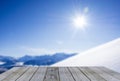 Wood display shelf winter table top against snow mountain panorama blue sky Royalty Free Stock Photo