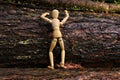 Wood doll climbing a tree Royalty Free Stock Photo