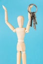 Wood doll holding set of retro keys Royalty Free Stock Photo