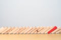 wood domino blocks falling on table. Crisis, fall Business, Risk management, Economic recession, Strategy and solutions concept Royalty Free Stock Photo