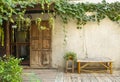 Wood door and bamboo bench with green plant