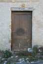 wood door in a village (saint-cirq-la-popie) - france