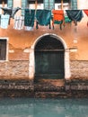 Wood door and window. On redbrick wall, building facade in Venice, exterior design Royalty Free Stock Photo