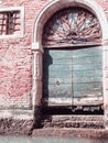 Wood door and window. On redbrick wall, building facade in Venice, exterior design Royalty Free Stock Photo
