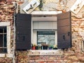 Wood door and window. On redbrick wall, building facade in Venice, exterior design Royalty Free Stock Photo