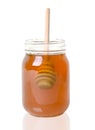 Wood Drizzler In Jar Of Honey, Isolated