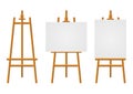 Wood easels or painting art boards with white canvas of different sizes. Easels with horizontal and vertical paper