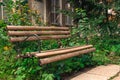 Wood empty bench in tall gren grass outdoor in park abandoned Royalty Free Stock Photo