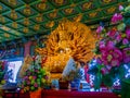 Wood engraved Thousand-hand Guan Yin at Chinese church in Thailand.