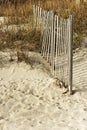 Fence on sand dune Royalty Free Stock Photo