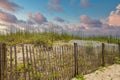 Wood Fence And Sand Dunes At Beach