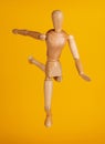 Wood figure in soccer pose