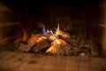 Wood fire burning in a brick hearth Royalty Free Stock Photo