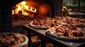 Wood Fired Pizza Oven with fresh pizzas resting surrounded by fresh herbs