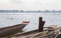 Wood Fishing Boat or Rowboat on Swamp with Wood Boat Pole Royalty Free Stock Photo