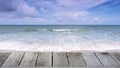 Wood floor on Beautiful Tropical sandy beach with blue ocean and blue sky background and wave crashing on sandy shore Royalty Free Stock Photo