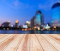 wood floor and blurred cityscape at twilight with bokeh. Royalty Free Stock Photo