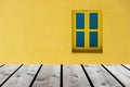 Wood floor with closed yellow and blue window on yellow wall background . can be used for display or montage your products Royalty Free Stock Photo