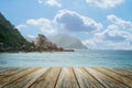 Wood floor foreground on horizon tropical sandy beach. The blur blue sea background with relaxing summer vacation with sunrise sun Royalty Free Stock Photo