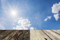 Wood floor with sun star and blue sky background Royalty Free Stock Photo