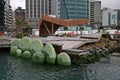 Modern North Kumutoto Pavilion on coastal decked square, and waterfront artwork of Nga Kina shells in Wellington CBD, New Zealand