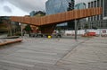 Modern wood North Kumutoto Pavilion with strips on folded plates and steel posts on decked square in Wellington CBD, New Zealand Royalty Free Stock Photo