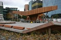 Modern wood North Kumutoto Pavilion with strips on folded plates and steel posts on decked square in Wellington CBD, New Zealand