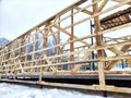 Wood frame house under construction, bare frame, walls with pile foundation, winter season Royalty Free Stock Photo