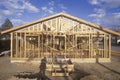 Wood frame of house under construction, Lone Pine, CA Royalty Free Stock Photo