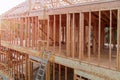 Wood frame residential building under construction framing new home Royalty Free Stock Photo