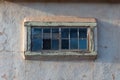 Wood frame window set into an old adobe house, centered, American Southwest