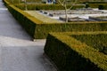 Wood framed herb beds in the monastery garden castle. rectangular flower bed with herbs and park paths of bright colors. Maintaine