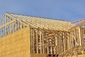 Wood framework of new residential home under construction.