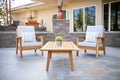 wood furniture on flagstone patio Royalty Free Stock Photo