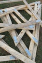 Wood gable triangle roof frame pile on grass