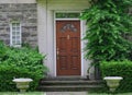 wood grain front door of old stone house Royalty Free Stock Photo