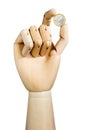 Wood hand with euro coin