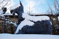 Wood horse and snow, natural background in brown hues Royalty Free Stock Photo