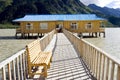 Wood house in lake near mountain Royalty Free Stock Photo