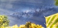 wood house with milky way on the background and light from the moon on the horizon line Royalty Free Stock Photo