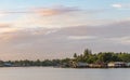 Wood houses along river in Asia with beautiful sky