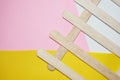 Wood ice-cream stick isolated on Yellow, pink and white background Royalty Free Stock Photo