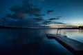 Wood jetty in lake at evening for bathing and swimming