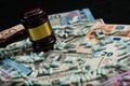 Wood judge& x27;s gavel and scattered colorful drugs on the dollar an Royalty Free Stock Photo