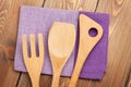 Wood kitchen utensils over wooden table Royalty Free Stock Photo