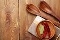 Wood kitchen utensils over wooden table background Royalty Free Stock Photo