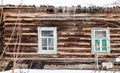 wood log wall with windows of old rural house Royalty Free Stock Photo