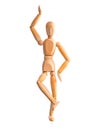 Wood mannequin holds balance on one leg