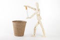 Wood mannequin throw in the trash one cigarette Royalty Free Stock Photo
